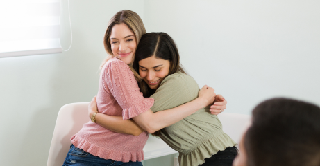 beautiful-young-women-hugging-smiling-after-finishing-group-therapy-session-feeling-happy-overcome-my-mental-health-problems-together-3.png
